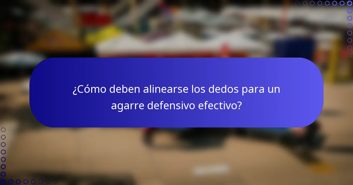 ¿Cómo deben alinearse los dedos para un agarre defensivo efectivo?